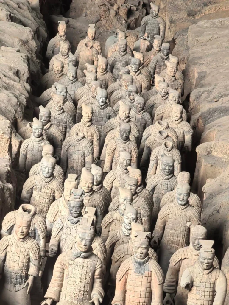 Ancient Terracotta Army soldiers in underground pit representing Qin Dynasty imperial history