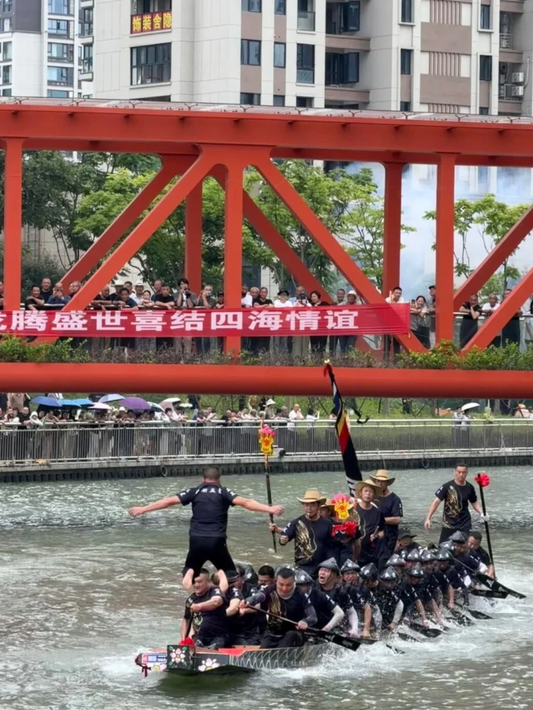 Dragon boat racing festival in China with paddlers competing on river during cultural celebration