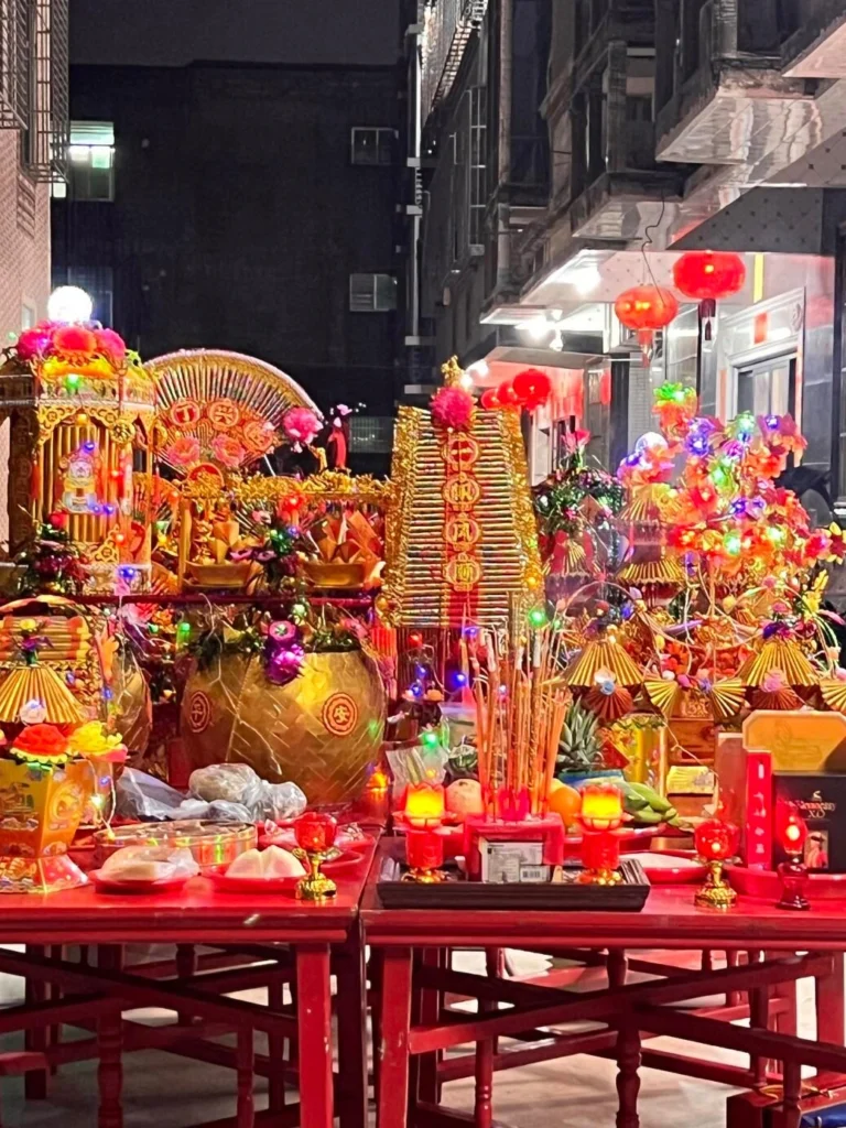 Traditional Chinese Mid Autumn Festival moon worship ceremony with elaborate altar offerings and lantern decorations